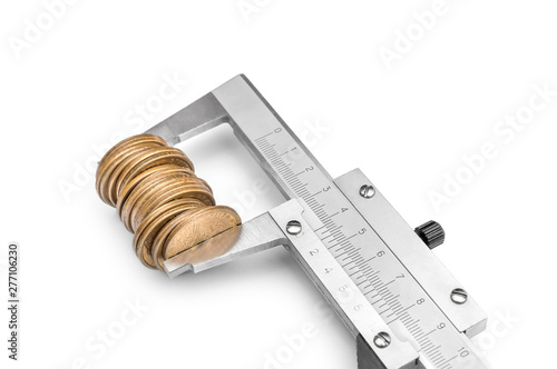 Vernier caliper with coins on white background. Business concept.