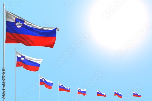 nice any occasion flag 3d illustration. - many Slovenia flags placed diagonal on blue sky with space for content