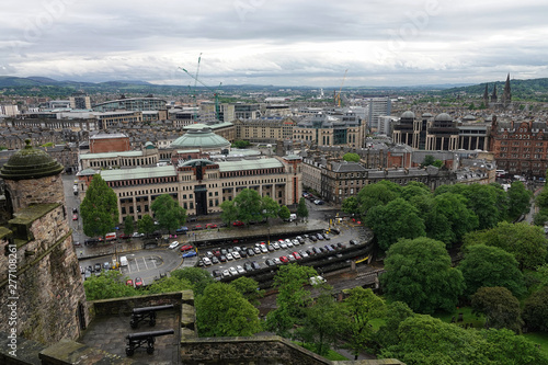 The cityscape of Edinburgh, Scotland, viewed southwest from Edinburgh Castle, is shown during a rainy day in 2019. © KilmerMedia