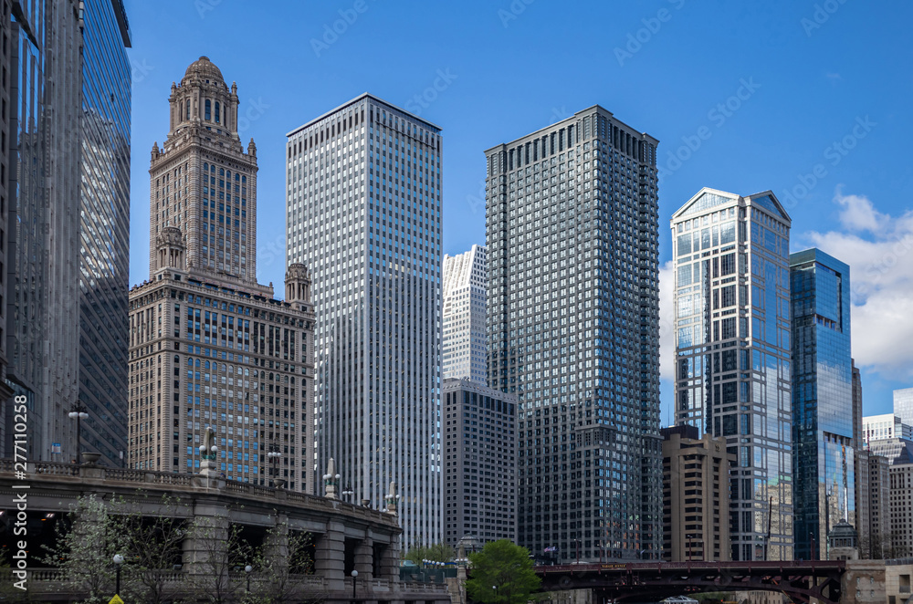 Chicago city skyscrapers on the river canal, blue sky background Chicago city skyscrapers on the river canal, blue sky background