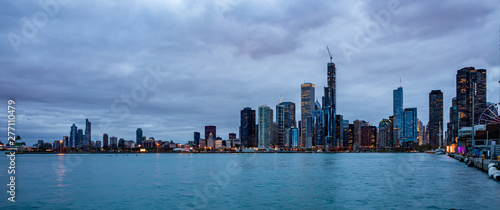 Panoramic view of Chicago city high rise buildings cloudy sky in the evening