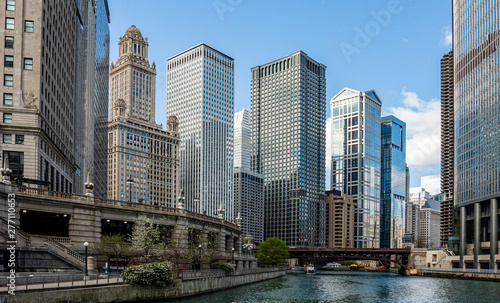 Chicago city skyscrapers on the river canal  blue sky background