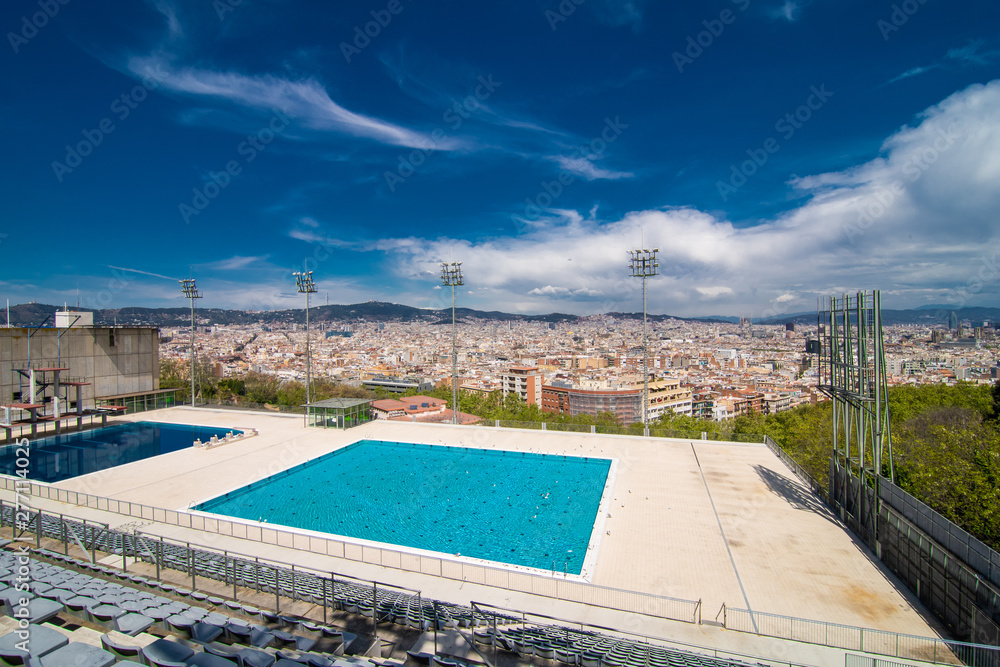 BARCELONA, SPAIN - April, 2019. Olympic swimming pool with a view on Barcelona city. Montjuic mountain.