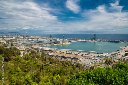 Barcelona, Spain - April, 2019: Barcelona and port Port Vell from natural park Montjuic, Spain