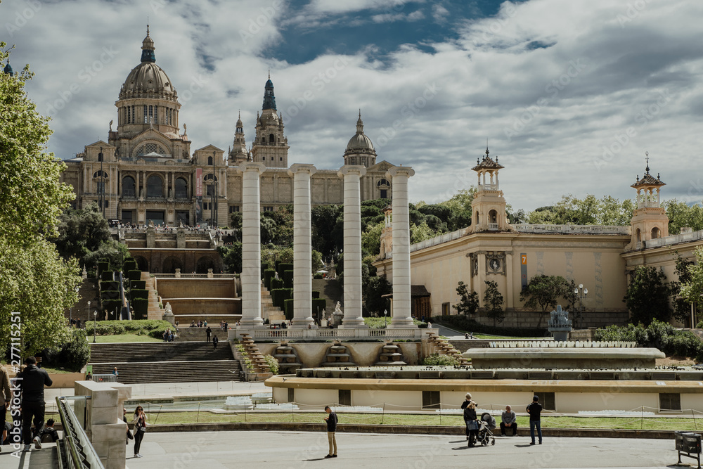 BARCELONA, SPAIN - April, 2019: View and the fountains at the Palau Nacional, a palace constructed for the 1929 International Exhibition in Barcelona