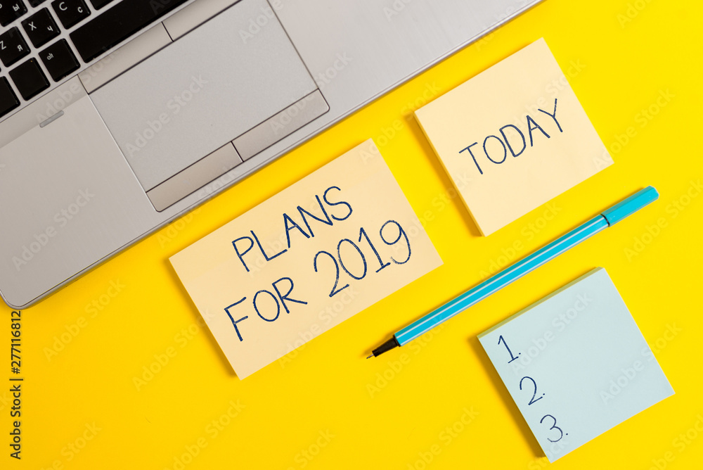 Conceptual hand writing showing Plans For 2019. Concept meaning an intention or decision about what one is going to do Silver laptop square sticky notepads marker colored background Conceptual hand writing showing Plans For 2019. Concept meaning an intention or decision about what one is going to do Silver laptop square sticky notepads marker colored background