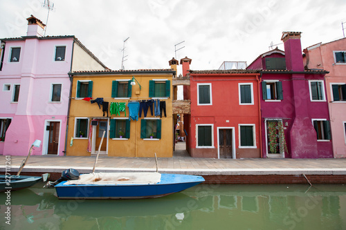 colorful houses on canal in Burano island italy