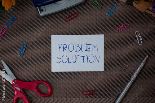 Writing note showing Problem Solution. Business concept for solving consists of using generic methods in orderly analysisner Scissor and writing equipments sheet above textured backdrop photo