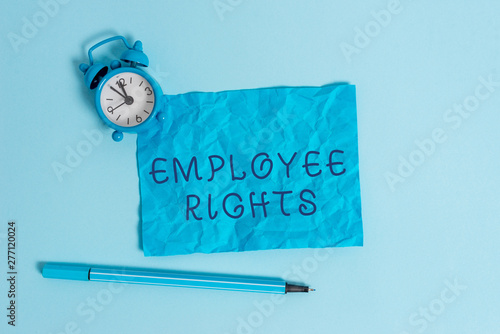 Writing note showing Employee Rights. Business concept for All employees have basic rights in their own workplace Metal vintage alarm clock crushed sheet marker sky colored background photo