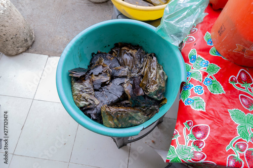 traditional tamales, wrapped in banana leaf valladolid, mexico photo