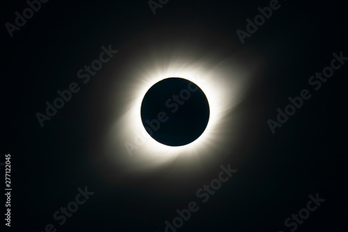 The Solar Corona atmosphere layer during Total Solar Eclipse Chile 2019, amazing view of the Sun covered by the Moon during totality phase while the Moon covers the entire Sun an awesome phenomenom