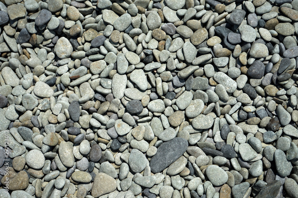 background texture of a beach with small pebbles background texture of a beach with small pebbles