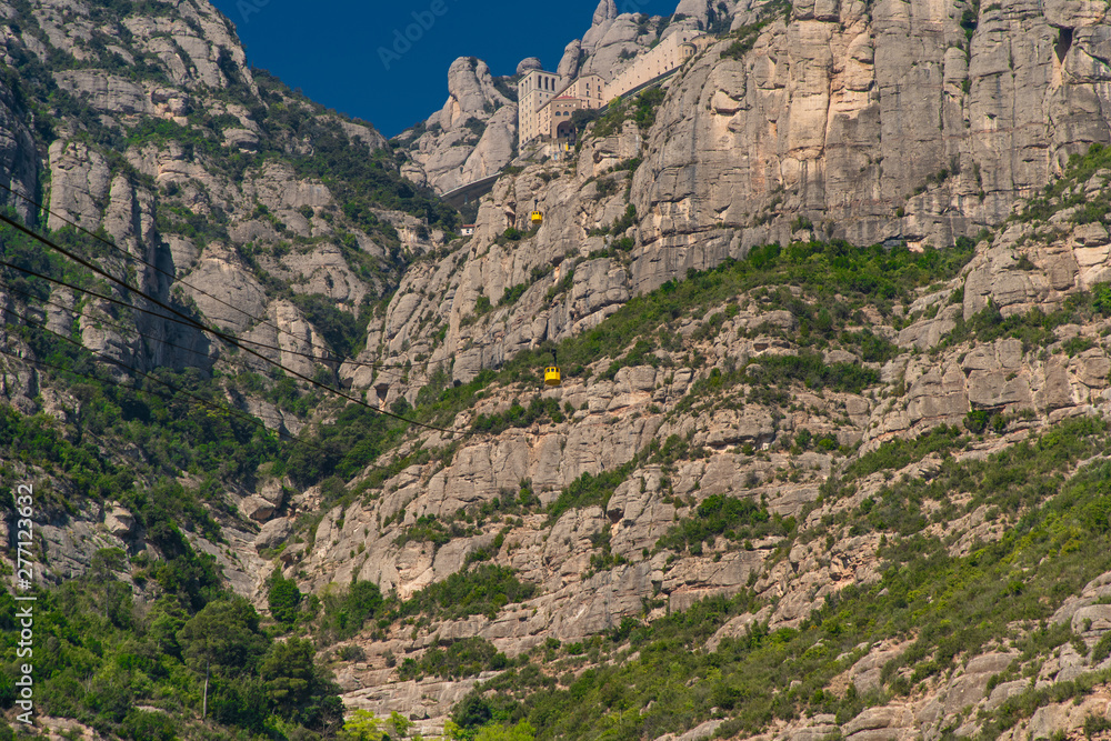 Fototapeta premium Montserrat, Spain - April, 2019: Santa Maria de Montserrat Abbey in Monistrol de Montserrat, Catalonia, Spain. Famous for the Virgin of Montserrat.