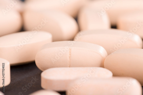 convex light-colored pills