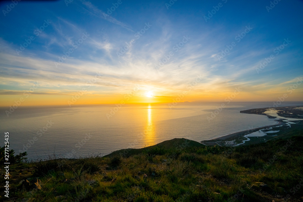 Aerial view of sunset over the ocean and beach from Point Magu, California