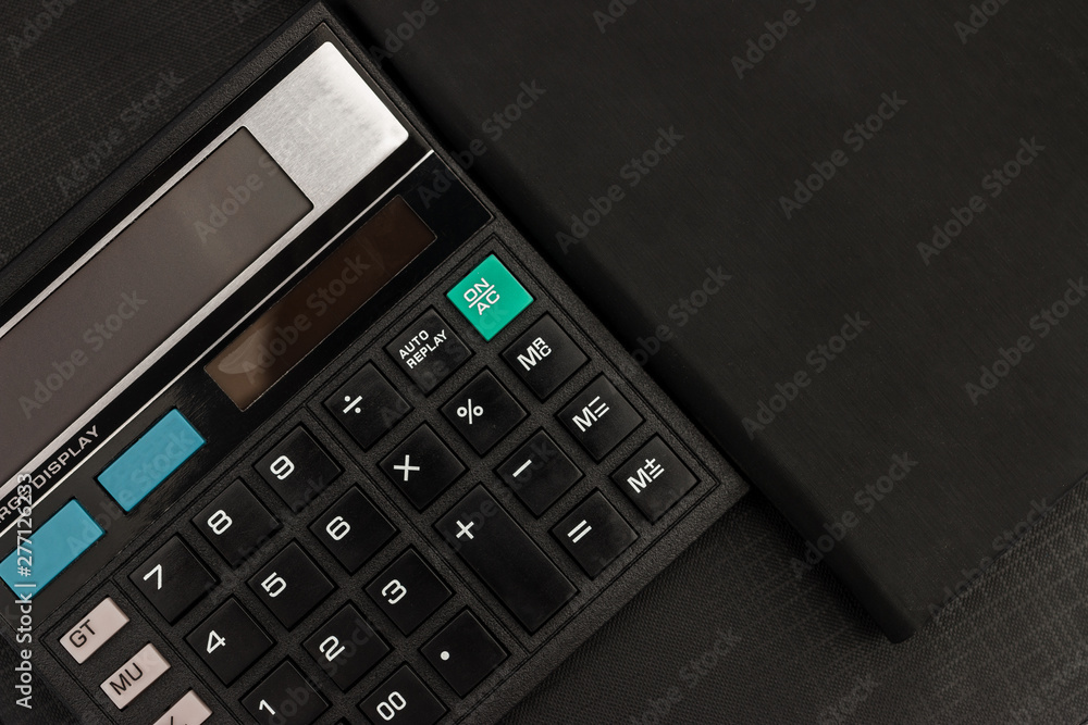 Top view calculator and documents for working on the table, Finance and savings, Business concept. Top view calculator and documents for working on the table, Finance and savings, Business concept.