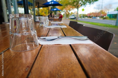 Outdoor Table setting at front of cafe overlooking a street