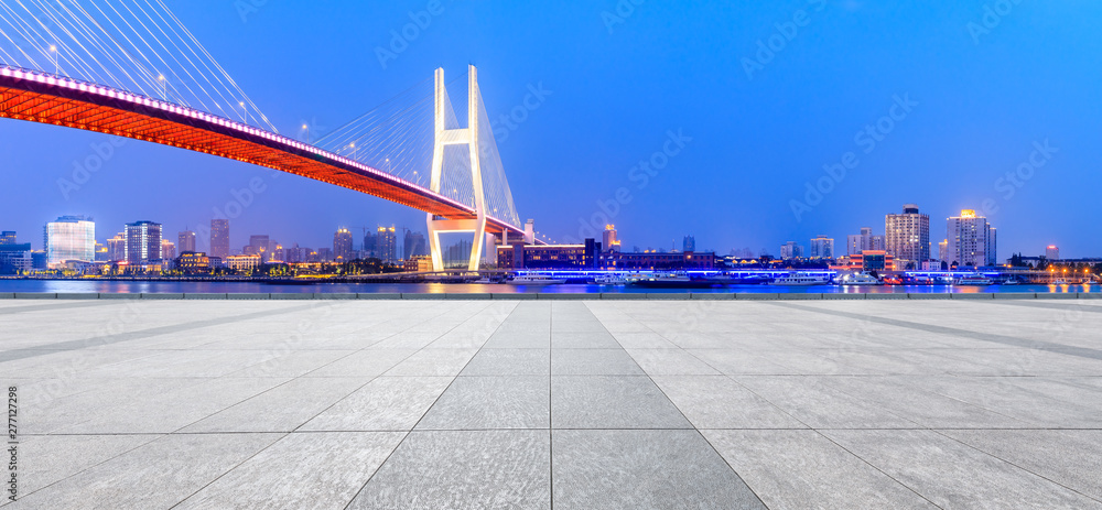 Fototapeta premium Shanghai Nanpu bridge and empty square floor scenery at night,China