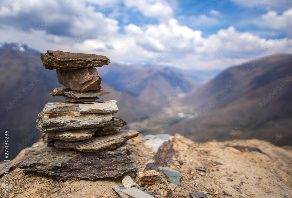 A stone cairn overlooking the mountains of the Sacred Valley, Peru