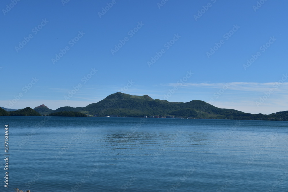 Lake Toya with Mount Usu in Hokkaido, Japan Lake Toya with Mount Usu in Hokkaido, Japan