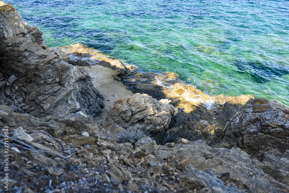Stunning view of a rocky coast bathed by a turquoise clear water, Emerald coast Sardinia, Italy. Stunning view of a rocky coast bathed by a turquoise clear water, Emerald coast Sardinia, Italy.