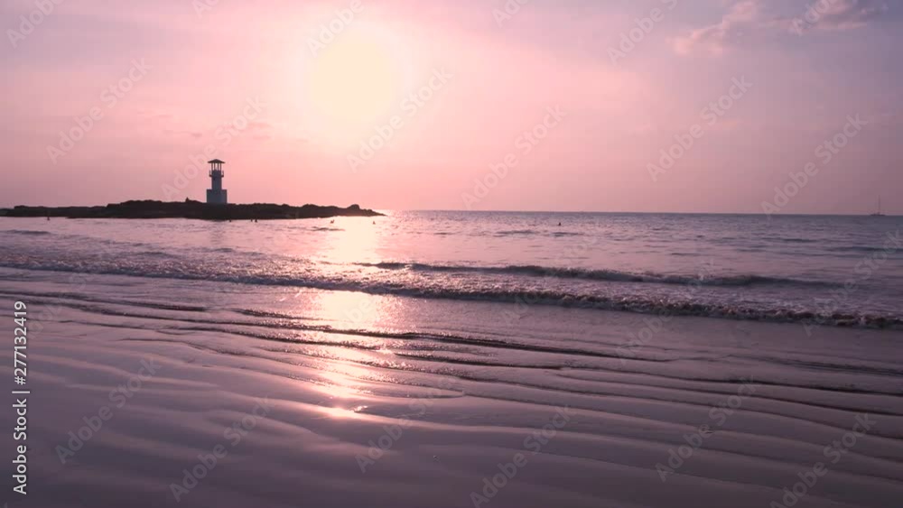 Lighthouse with the sunset at Nang Thong Beach Khao Lak Thailand. Soung of the sea. Lighthouse with the sunset at Nang Thong Beach Khao Lak Thailand. Soung of the sea.