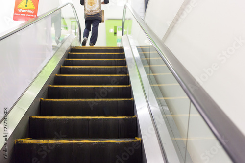 People on the escalator in shopping center
