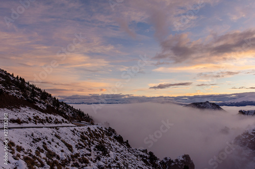 Winter sunset in the Andes mountains with fog in the valley