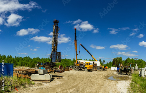 working construction site mobile drilling rig MBU installation on a well Bush photo