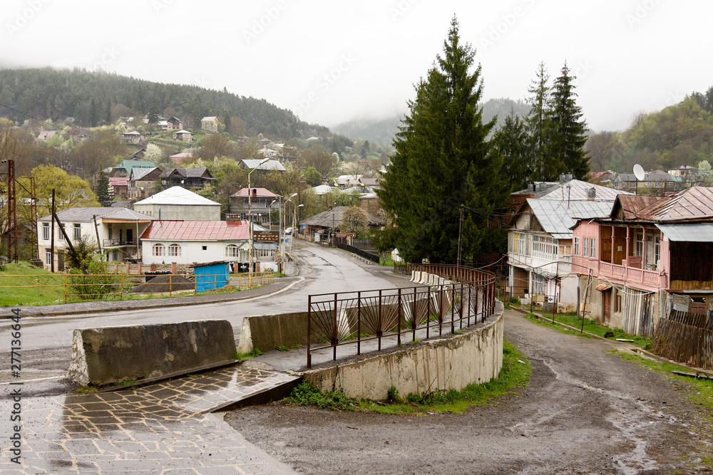 Street in village Mzetamze, Borjomi nearby, in rayny day. Climatic resort area in Georgia Street in village Mzetamze, Borjomi nearby, in rayny day. Climatic resort area in Georgia