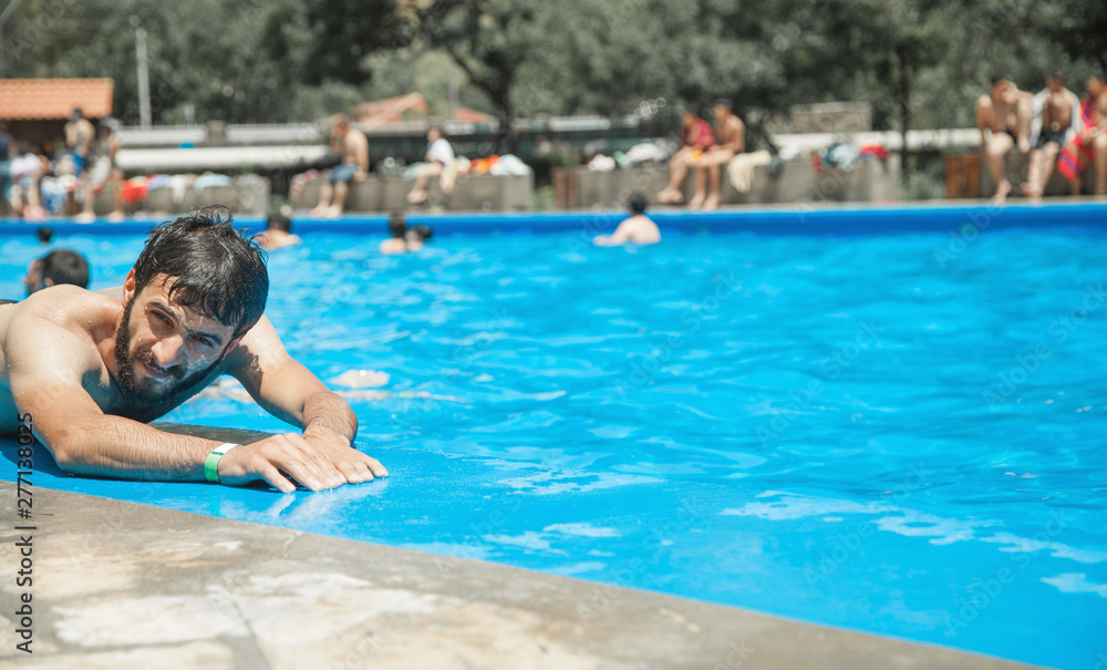 Caucasian man in the swimming pool.