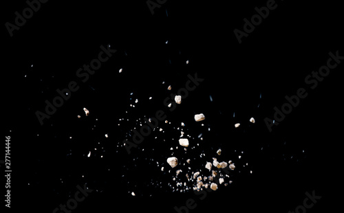 Fotografie, Obraz Break stone caused by explosion against black background