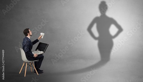Rich businessman staying and offering stuffs to a pretty shadow woman © ra2 studio