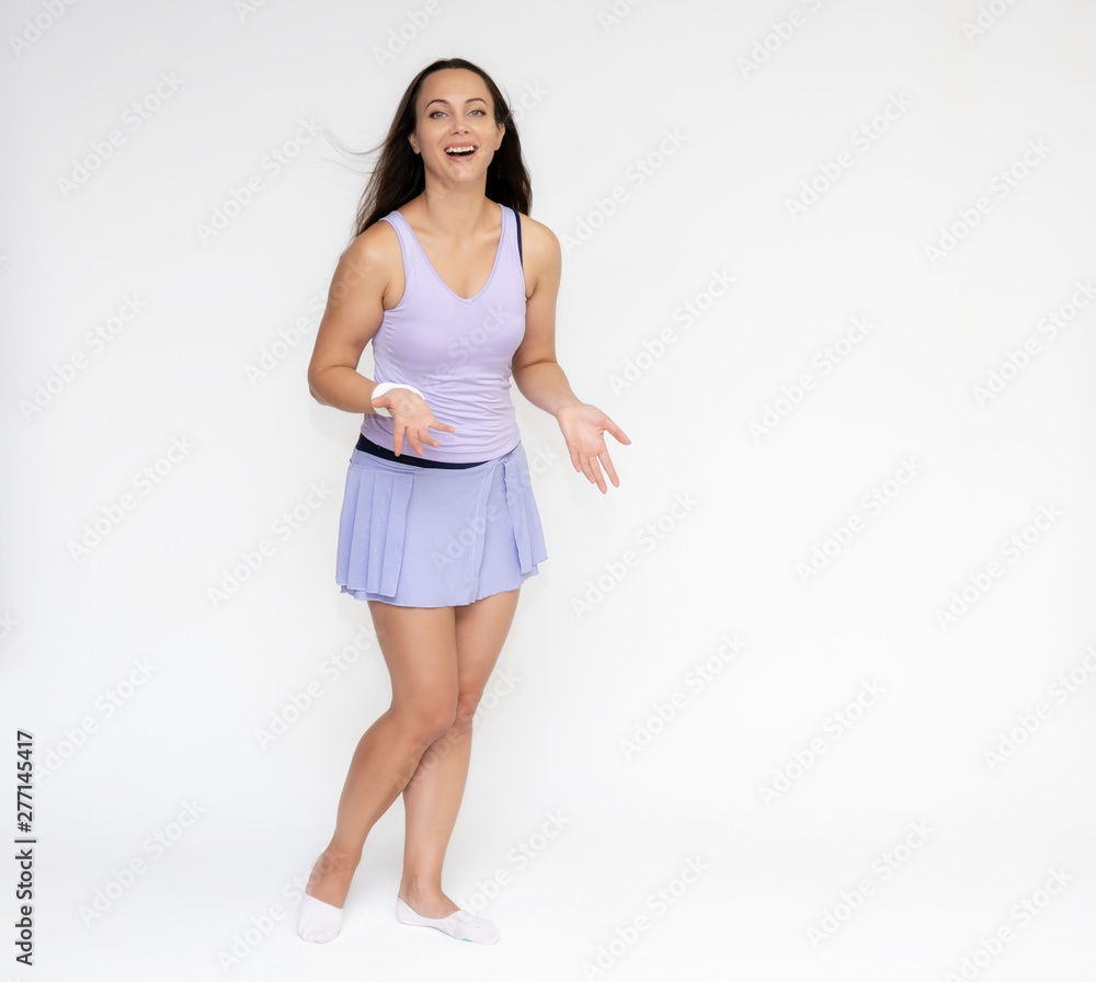 Full-length portrait on white background of beautiful pretty fitness girl woman in trendy tennis sport uniform, with different emotions in different poses, shows hands. Smiles. Stylish trendy youth.