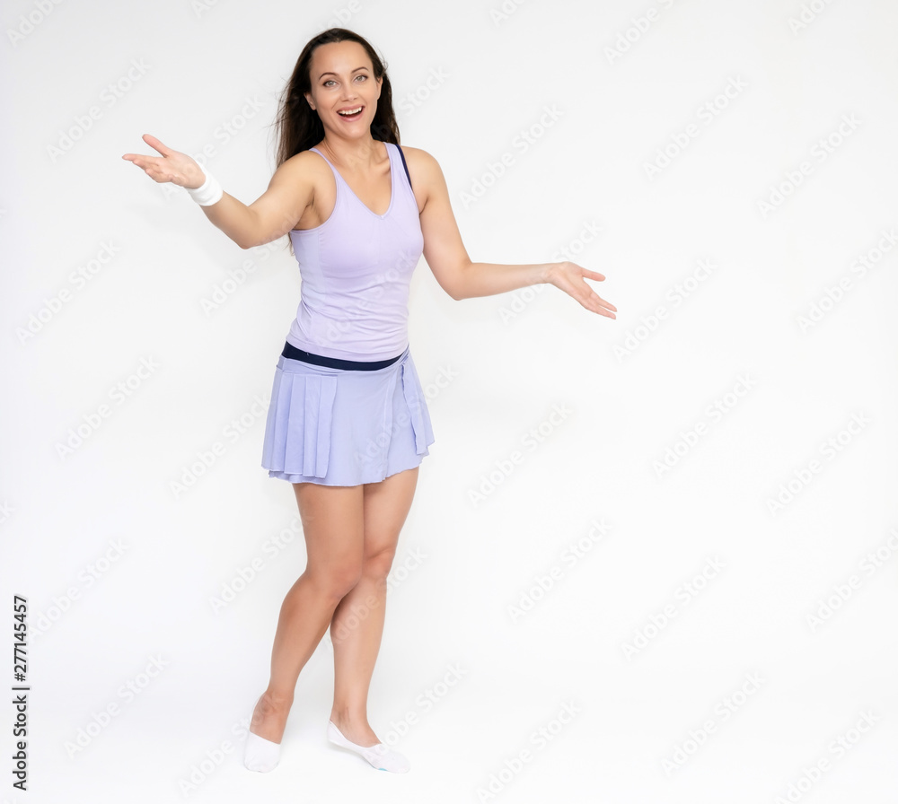 Full-length portrait on white background of beautiful pretty fitness girl woman in trendy tennis sport uniform, with different emotions in different poses, shows hands. Smiles. Stylish trendy youth. Full-length portrait on white background of beautiful pretty fitness girl woman in trendy tennis sport uniform, with different emotions in different poses, shows hands. Smiles. Stylish trendy youth.