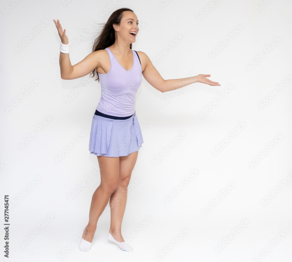Full-length portrait on white background of beautiful pretty fitness girl woman in trendy tennis sport uniform, with different emotions in different poses, shows hands. Smiles. Stylish trendy youth.