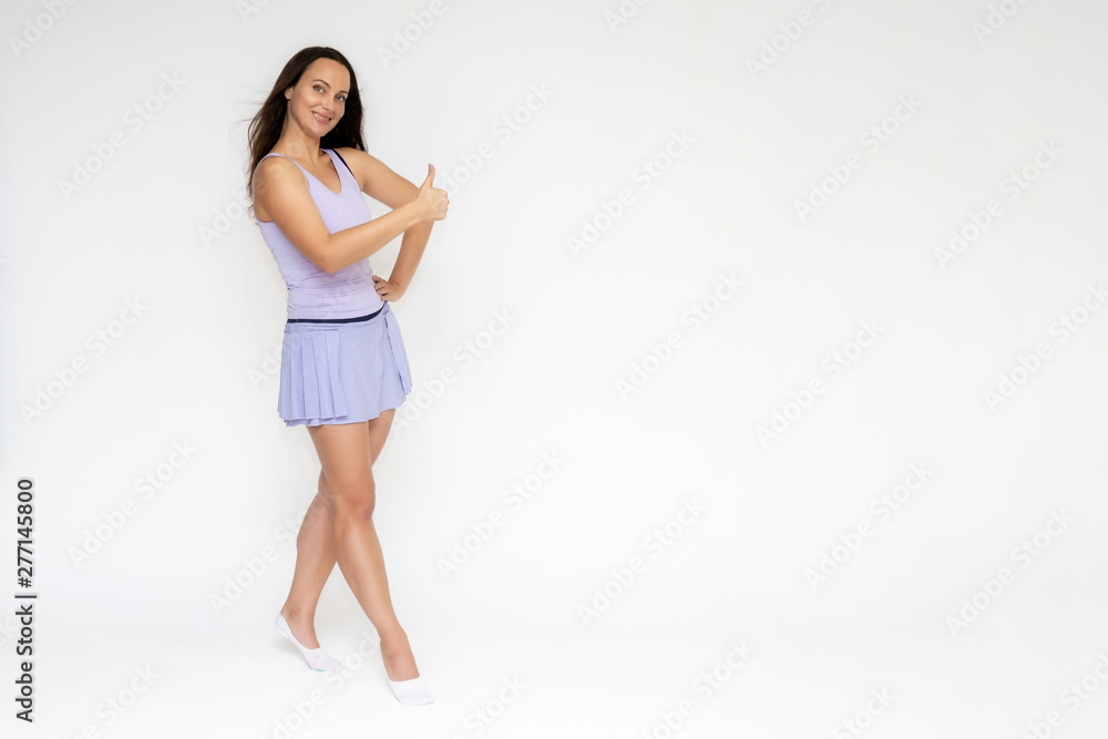 Full-length portrait on white background of beautiful pretty fitness girl woman in trendy tennis sport uniform, with different emotions in different poses, shows hands. Smiles. Stylish trendy youth. Full-length portrait on white background of beautiful pretty fitness girl woman in trendy tennis sport uniform, with different emotions in different poses, shows hands. Smiles. Stylish trendy youth.