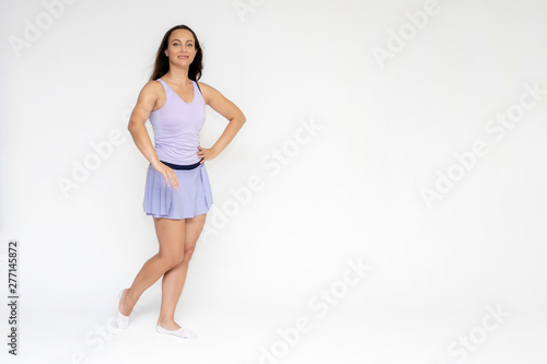 Full-length portrait on white background of beautiful pretty fitness girl woman in trendy tennis sport uniform, with different emotions in different poses, shows hands. Smiles. Stylish trendy youth. © Вячеслав Чичаев