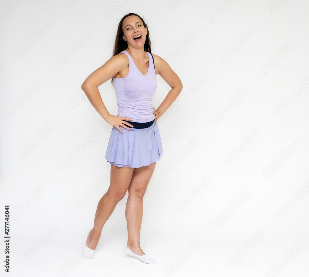 Full-length portrait on white background of beautiful pretty fitness girl woman in trendy tennis sport uniform, with different emotions in different poses, shows hands. Smiles. Stylish trendy youth. Full-length portrait on white background of beautiful pretty fitness girl woman in trendy tennis sport uniform, with different emotions in different poses, shows hands. Smiles. Stylish trendy youth.