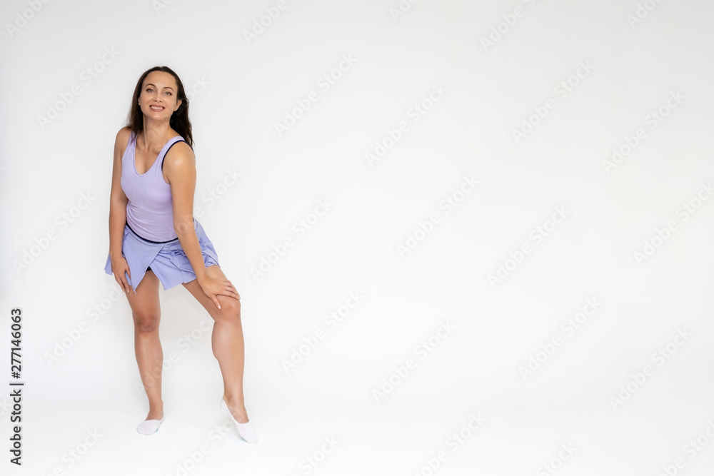 Full-length portrait on white background of beautiful pretty fitness girl woman in trendy tennis sport uniform, with different emotions in different poses, shows hands. Smiles. Stylish trendy youth. Full-length portrait on white background of beautiful pretty fitness girl woman in trendy tennis sport uniform, with different emotions in different poses, shows hands. Smiles. Stylish trendy youth.