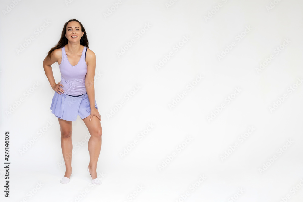 Full-length portrait on white background of beautiful pretty fitness girl woman in trendy tennis sport uniform, with different emotions in different poses, shows hands. Smiles. Stylish trendy youth. Full-length portrait on white background of beautiful pretty fitness girl woman in trendy tennis sport uniform, with different emotions in different poses, shows hands. Smiles. Stylish trendy youth.