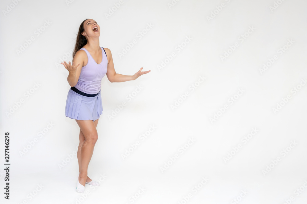 Full-length portrait on white background of beautiful pretty fitness girl woman in trendy tennis sport uniform, with different emotions in different poses, shows hands. Smiles. Stylish trendy youth. Full-length portrait on white background of beautiful pretty fitness girl woman in trendy tennis sport uniform, with different emotions in different poses, shows hands. Smiles. Stylish trendy youth.