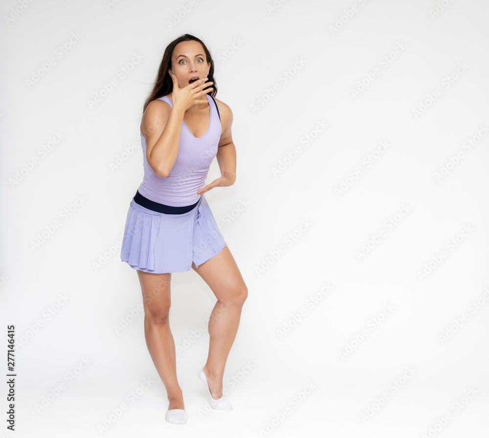 Full-length portrait on white background of beautiful pretty fitness girl woman in trendy tennis sport uniform, with different emotions in different poses, shows hands. Smiles. Stylish trendy youth.
