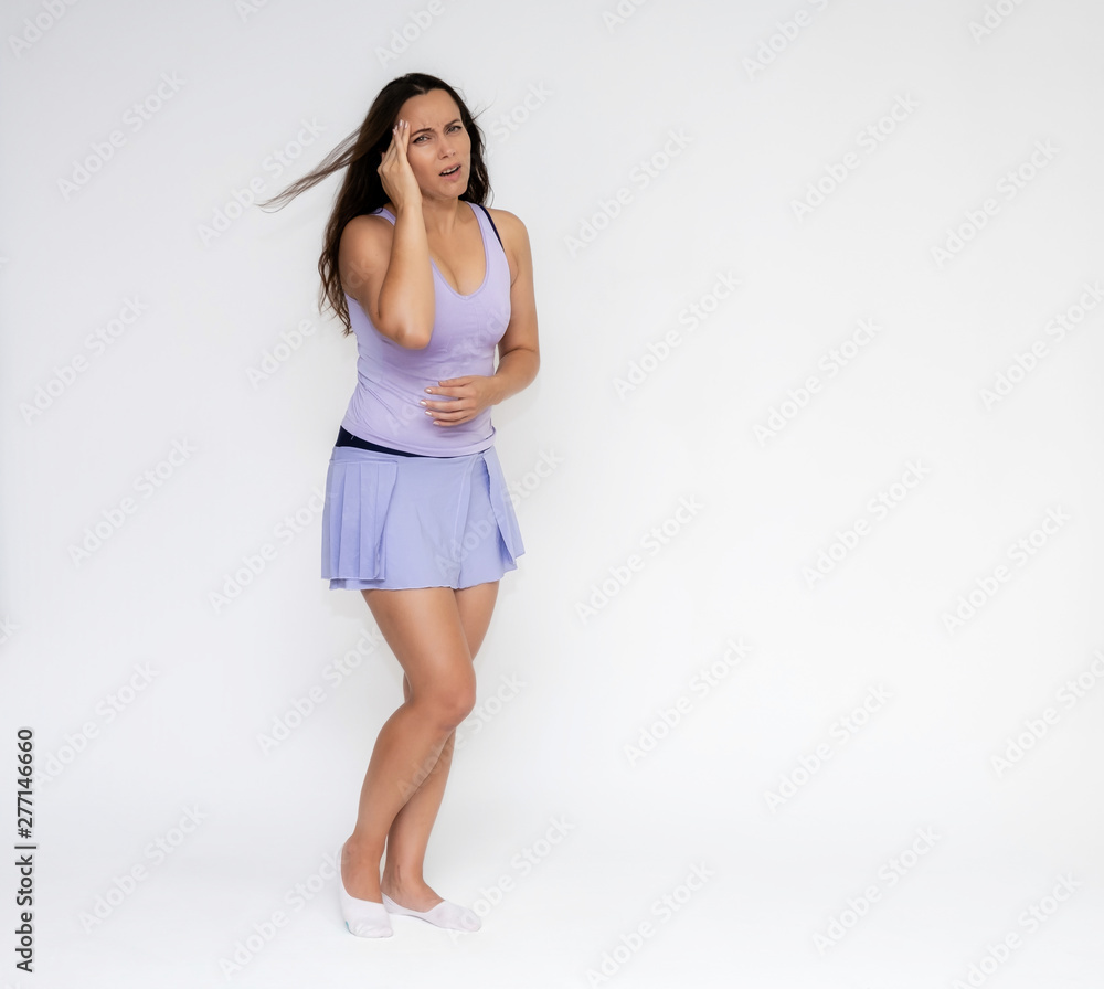 Full-length portrait on white background of beautiful pretty fitness girl woman in fashionable tennis sportswear, experiencing pain, injury in various poses, shows hands. Smiles Stylish trendy youth. Full-length portrait on white background of beautiful pretty fitness girl woman in fashionable tennis sportswear, experiencing pain, injury in various poses, shows hands. Smiles Stylish trendy youth.