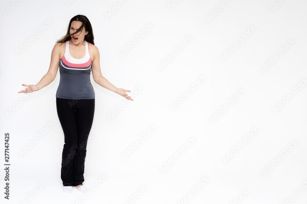 Full-length portrait on white background of beautiful pretty fitness girl woman in sports uniform, sitting on the stairs with different emotions in different poses. Stylish trendy youth. Full-length portrait on white background of beautiful pretty fitness girl woman in sports uniform, sitting on the stairs with different emotions in different poses. Stylish trendy youth.