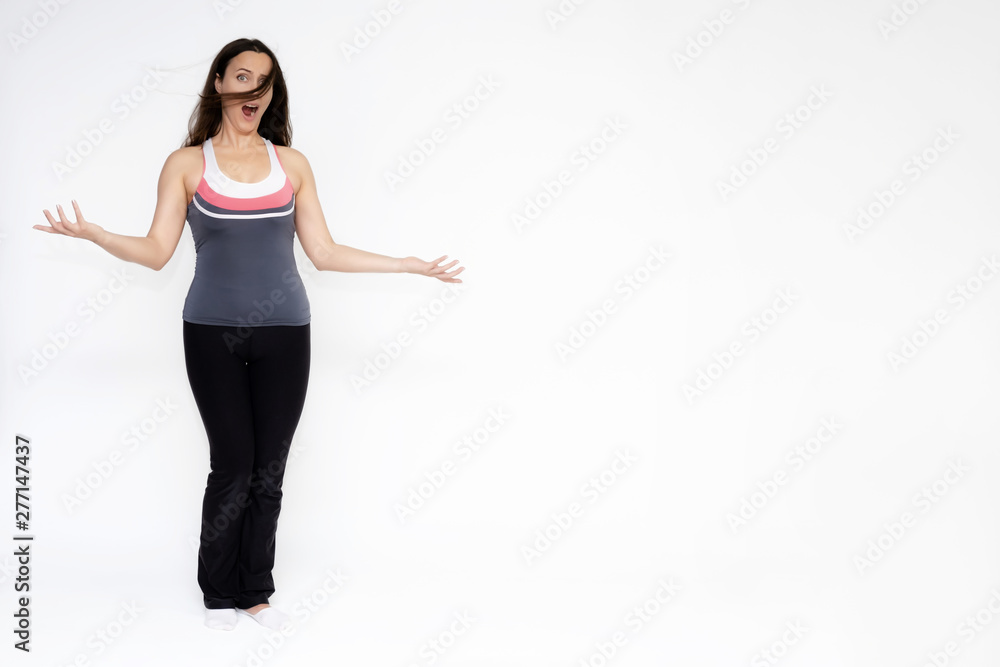 Full-length portrait on white background of beautiful pretty fitness girl woman in sports uniform, sitting on the stairs with different emotions in different poses. Stylish trendy youth. Full-length portrait on white background of beautiful pretty fitness girl woman in sports uniform, sitting on the stairs with different emotions in different poses. Stylish trendy youth.