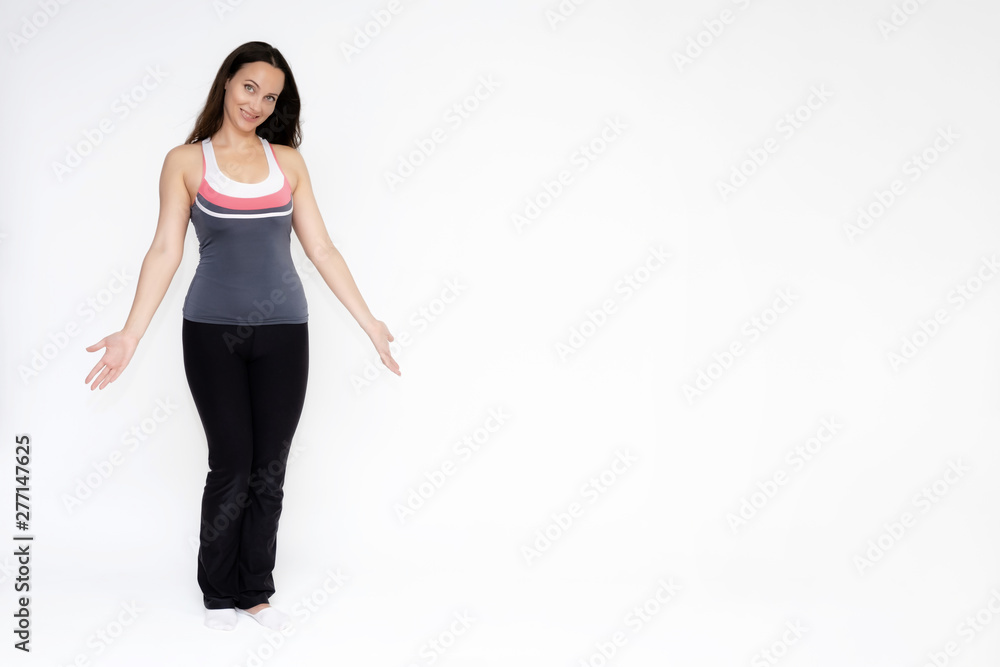 Full-length portrait on white background of beautiful pretty fitness girl woman in sports uniform, sitting on the stairs with different emotions in different poses. Stylish trendy youth. Full-length portrait on white background of beautiful pretty fitness girl woman in sports uniform, sitting on the stairs with different emotions in different poses. Stylish trendy youth.