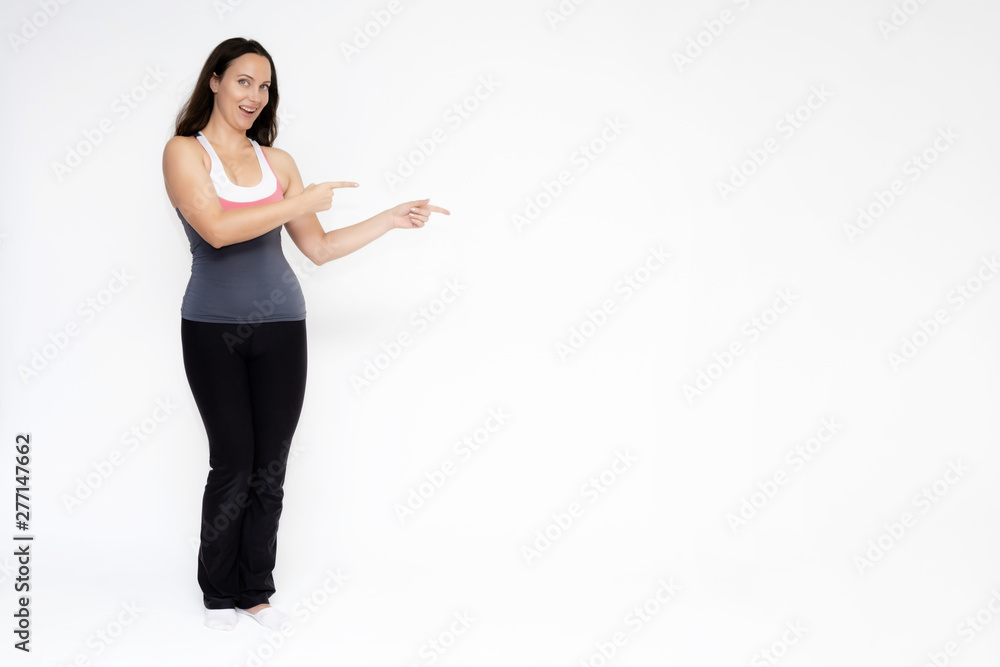 Full-length portrait on white background of beautiful pretty fitness girl woman in sports uniform, sitting on the stairs with different emotions in different poses. Stylish trendy youth. Full-length portrait on white background of beautiful pretty fitness girl woman in sports uniform, sitting on the stairs with different emotions in different poses. Stylish trendy youth.