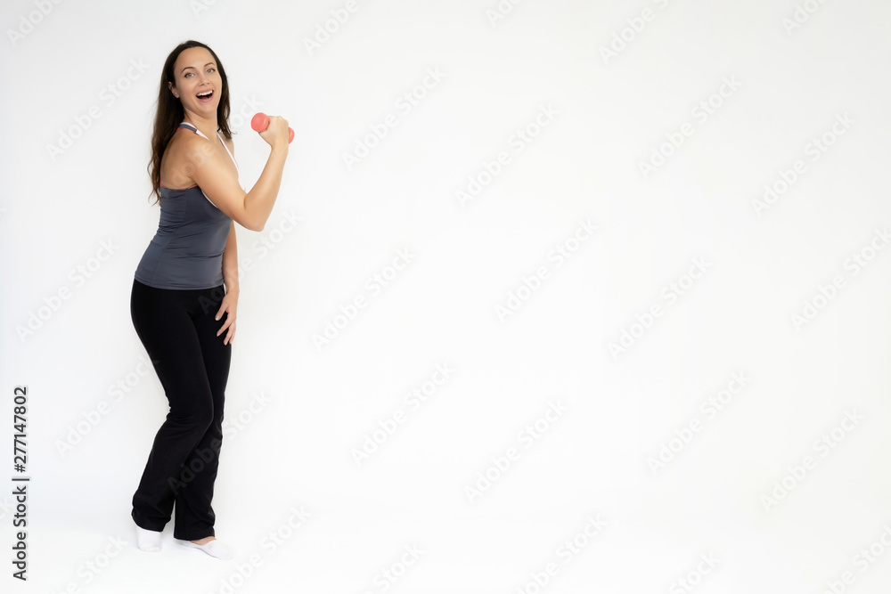 Full-length portrait on white background of beautiful pretty fitness girl woman in sports uniform, sitting on the stairs with different emotions in different poses. Stylish trendy youth. Full-length portrait on white background of beautiful pretty fitness girl woman in sports uniform, sitting on the stairs with different emotions in different poses. Stylish trendy youth.