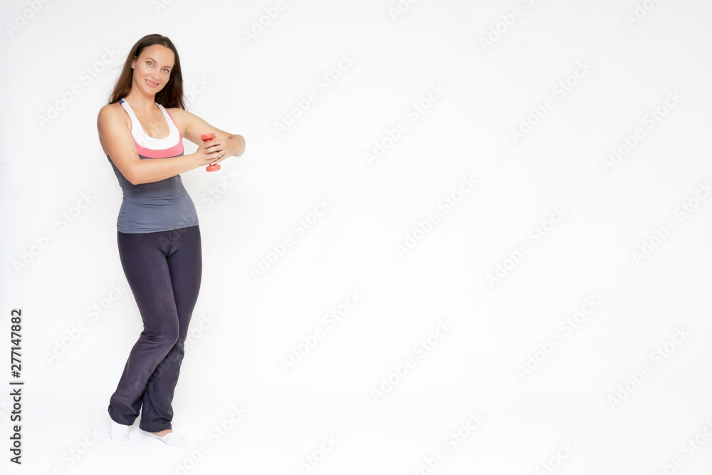 Full-length portrait on white background of beautiful pretty fitness girl woman in sports uniform, sitting on the stairs with different emotions in different poses. Stylish trendy youth. Full-length portrait on white background of beautiful pretty fitness girl woman in sports uniform, sitting on the stairs with different emotions in different poses. Stylish trendy youth.